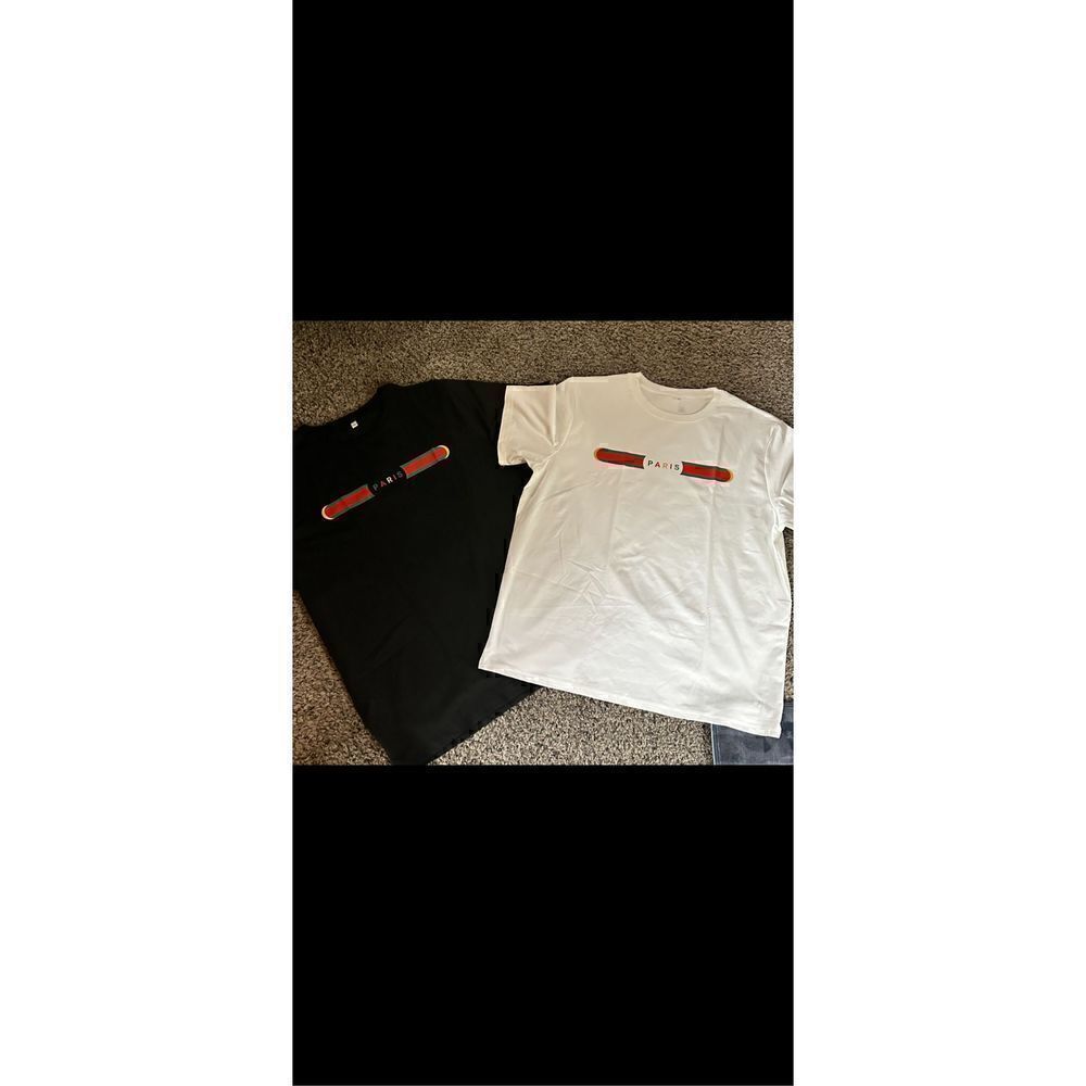 Two Tee shirts black and white XXL. Well made not flimsy.